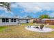 Backyard with firepit and seating area at 4760 84Th N Ter, Pinellas Park, FL 33781