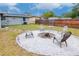 Firepit area with seating in backyard at 4760 84Th N Ter, Pinellas Park, FL 33781