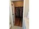 Walk-in closet with ample hanging space and wood flooring at 3508 Cowart St, New Port Richey, FL 34655