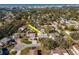 Aerial view of house, highlighting its location near water and other homes at 8280 140Th St, Seminole, FL 33776