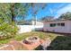 Backyard with firepit and stone bench at 8280 140Th St, Seminole, FL 33776