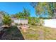 Large backyard with firepit, shed, and mature trees at 8280 140Th St, Seminole, FL 33776