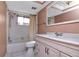 Bathroom with beige vanity, shower, and bathtub at 8280 140Th St, Seminole, FL 33776