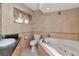 Elegant bathroom with a large jacuzzi tub and granite vanity at 8280 140Th St, Seminole, FL 33776
