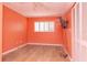 Coral bedroom with wood-look flooring and built-in shelving at 8280 140Th St, Seminole, FL 33776