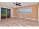 Spacious bedroom with tile flooring and sliding glass doors at 8280 140Th St, Seminole, FL 33776