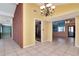 Dining room with tile floors, chandelier and open views to kitchen and Gathering room at 8280 140Th St, Seminole, FL 33776