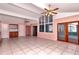 Large Gathering room with tile floors, high ceilings, and access to a sunroom at 8280 140Th St, Seminole, FL 33776