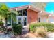 Mid-century home's entrance with brick facade, double doors and lush landscaping at 8280 140Th St, Seminole, FL 33776