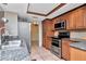 Modern kitchen featuring stainless steel appliances and ample wood cabinetry at 8280 140Th St, Seminole, FL 33776