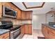 Updated kitchen with granite countertops, wood cabinets, and recessed lighting at 8280 140Th St, Seminole, FL 33776