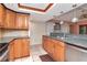 Eat-in kitchen with granite countertops, stainless steel appliances, and wood cabinets at 8280 140Th St, Seminole, FL 33776