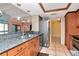 Modern kitchen with granite countertops, stainless steel appliances, and wood cabinets at 8280 140Th St, Seminole, FL 33776