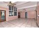 Sunlit living room with large windows, tile floors, and access to outdoor space at 8280 140Th St, Seminole, FL 33776