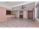 Bright living room featuring high ceilings, tile floors, and built-in cabinetry at 8280 140Th St, Seminole, FL 33776