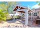 White pergola with ceiling fan over patio at 8280 140Th St, Seminole, FL 33776