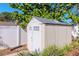 Tan shed with white double doors in backyard at 8280 140Th St, Seminole, FL 33776