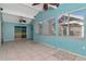 Bright sunroom with tile floors and ceiling fan at 8280 140Th St, Seminole, FL 33776