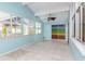 Bright sunroom with tile floors and ceiling fan at 8280 140Th St, Seminole, FL 33776