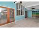 Bright sunroom with tile flooring, wood doors and large windows at 8280 140Th St, Seminole, FL 33776