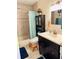 Bathroom with tub, vanity, and storage cabinet at 1655 58Th S Ter # 3, St Petersburg, FL 33712