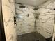 Large walk-in shower with double shower heads and marble tile at 2695 68Th S Ave, St Petersburg, FL 33712