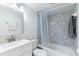 Bathroom with a shower/tub combo, vanity, and mirror at 7182 E Bank Dr # 7-103, Tampa, FL 33617