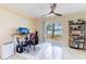 Bright home office features a stand-up desk, lake view, and built-in shelving at 7182 E Bank Dr # 7-103, Tampa, FL 33617