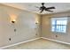 Cozy bedroom with sconce lighting and a window offering natural light at 7644 Arlight Dr, New Port Richey, FL 34655