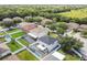 Bird's eye view of the home featuring the screened-in pool and surrounding houses at 11143 Rising Mist Blvd, Riverview, FL 33578