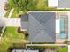 Overhead shot showcasing the home's roof, pool, landscaping, and driveway at 11143 Rising Mist Blvd, Riverview, FL 33578