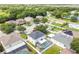 Wide aerial view showing the home, screened-in pool, and green neighborhood at 11143 Rising Mist Blvd, Riverview, FL 33578