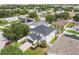 Overhead shot showing a home with a dark roof and screened-in pool at 11143 Rising Mist Blvd, Riverview, FL 33578