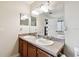 Bathroom featuring a double sink vanity with a large mirror and overhead lighting at 11143 Rising Mist Blvd, Riverview, FL 33578