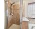 Bathroom featuring a shower with tile surround and glass door at 11143 Rising Mist Blvd, Riverview, FL 33578