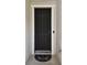 A stylish black front door with an electronic lock at 11143 Rising Mist Blvd, Riverview, FL 33578