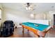 Billiards room featuring a pool table on hardwood floors with good lighting and ample space at 11143 Rising Mist Blvd, Riverview, FL 33578