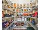 Well-organized walk-in pantry with wire shelving stocked with various food items and containers at 11143 Rising Mist Blvd, Riverview, FL 33578