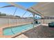 Screened in pool with brick paver deck, covered lanai, and private fenced yard at 11143 Rising Mist Blvd, Riverview, FL 33578