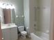 Bathroom with a shower-tub combo and a single sink vanity at 24289 Toth Ln, Punta Gorda, FL 33955