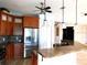 Bright kitchen with stainless steel appliances, a granite counter, and dark wood cabinetry at 24289 Toth Ln, Punta Gorda, FL 33955