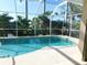 Screened pool area overlooking the lake at 24289 Toth Ln, Punta Gorda, FL 33955