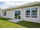 Rear view of house showing sliding glass doors and windows at 8126 Chesebro Ave, North Port, FL 34287