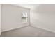 Bright bedroom with a large window and neutral carpeting at 2614 58Th E Cir, Palmetto, FL 34221