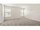 Bright bedroom featuring two windows and neutral carpeting at 2614 58Th E Cir, Palmetto, FL 34221