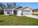 Charming single-Gathering home with a well-manicured lawn and neutral gray paint at 2614 58Th E Cir, Palmetto, FL 34221