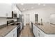 Modern kitchen with stainless steel appliances, granite countertops, and white cabinetry at 2614 58Th E Cir, Palmetto, FL 34221