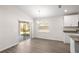 Eat-in kitchen featuring gray plank flooring and sliding glass doors at 2614 58Th E Cir, Palmetto, FL 34221