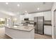 Bright kitchen with white cabinets, stainless steel appliances, and granite countertops at 2614 58Th E Cir, Palmetto, FL 34221