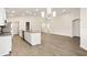 Open floor plan with a kitchen island, dining area, and ample natural light at 2614 58Th E Cir, Palmetto, FL 34221